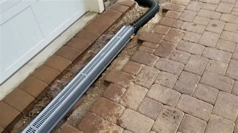 installing channel drain in concrete.